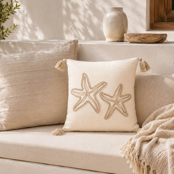 Coussin décoratif étoile de mer beige à pompons